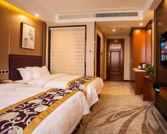 Greentree Eastern Bozhou Jingwan Wealth Centre Hotel - Bozhou - Спальня