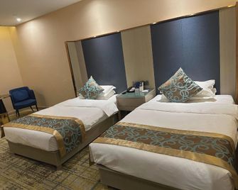 Yiyi Time Hotel (Jiayuguan Xiongguan Donghu Ecological Scenic Area) - Jiayuguan - Bedroom