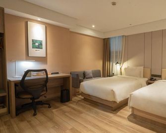 Xuzhou Pengcheng Square Riverside Hotel - Xuzhou - Slaapkamer