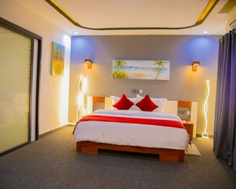 Hotel La Casa Cielo - קוטונו - חדר שינה
