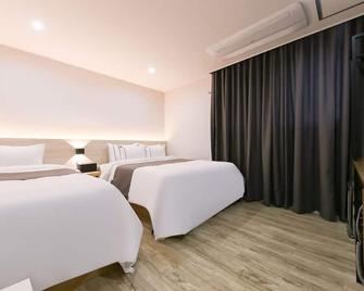 Daejeon Yuseong Hotel Dret - Daejeon - Schlafzimmer