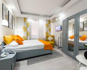 Relax Comfort Suites - Bukares - Kamar Tidur