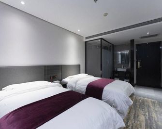 Qindao Business Hotel - زيان - غرفة نوم