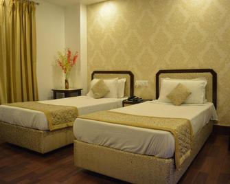 Hotel Prag Continental - Guwahati - Bedroom