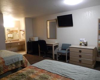 Pearsall Executive Inn And Suites - Pearsall - Спальня