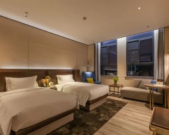 Echarm Plus Hotel (Wuhan Wenhua Avenue Dahualing Metro Station) - Wuhan - Makuuhuone
