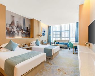 Chizhou Daqianmen Light Luxury Hotel - Chizhou - Bedroom