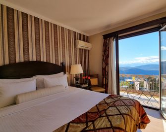 Likoria Hotel - אראכובה - חדר שינה