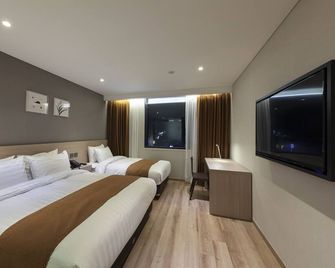 Gangneung City Hotel - Gangneung - Slaapkamer