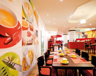 Vienna House Easy by Wyndham Rostock - Rostock - Yemek odası