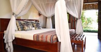 African Roots Guesthouse - Entebbe - Makuuhuone