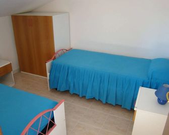 Appartamenti Villa Chiara - Імперія - Спальня