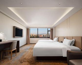 Rose Hotel - Zibo - Slaapkamer