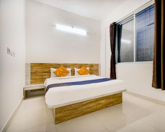 Spot On Ambience Inn - Pune - Schlafzimmer