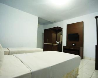 Urbanview Hotel Mulia Indah Palopo - Palopo - Habitación