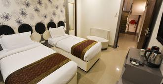 OYO 514 Nirvana Hotel - Benares - Slaapkamer