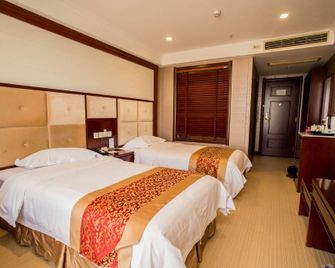 Xiushan International Hotel - Chizhou - Schlafzimmer