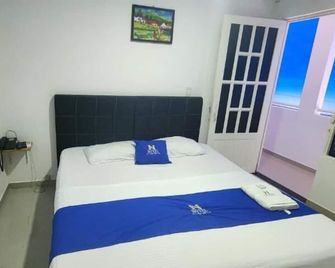 Hotel Noz Inn - Villavicencio - Schlafzimmer