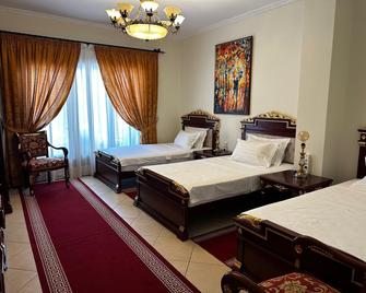 فندق ديناستي - تيرانا - غرفة نوم