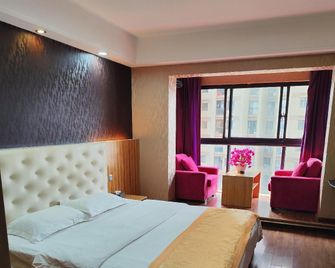 Kunming Sanxin Serviced Apartment Hotel (Binjiang Junyuan) - Kunming - Bedroom