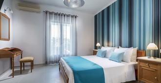 Santellini Hotel - Kamari - Schlafzimmer