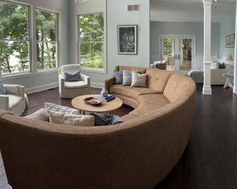 Lakefront fun: boat, hot tub, fire pit, kayaks, private swim island, game room - Berrien Springs - Living room