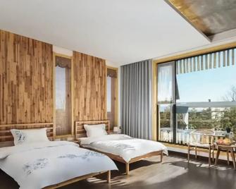 Floral Hotel Taishan Scenic Manmanlai - Tai’an - Bedroom