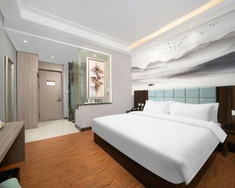 Harbin Blue Feather Hotel - Harbin - Bedroom