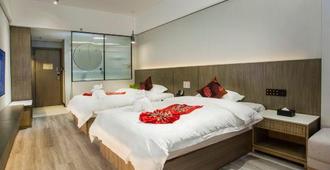 Hainan Tengpeng Hotel - ไหโข่ว - ห้องนอน