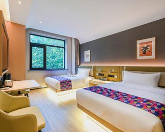 Light year Beach Park Resort Hotel - Qinhuangdao - Schlafzimmer