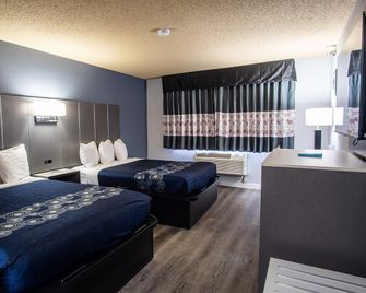 Coratel Inn and Suites By Jasper Eagan ST Paul Airport & Mall of America - Eagan - Schlafzimmer