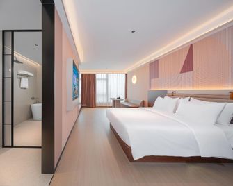 Man Yue Xian Zao Shi Liu Shi Hotel (Huizhou West Lake East Station Ganghui Shopping Center Branch) - 惠州 - 臥室