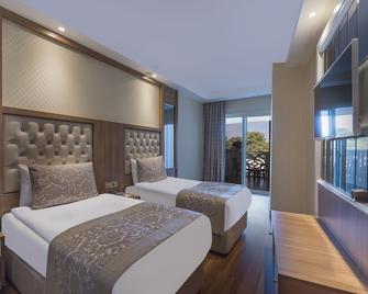 Oz Hotels Sui - Okurcalar - Bedroom