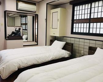 Guesthouse & Hotel Ra Kagoshima - Кагошіма - Спальня