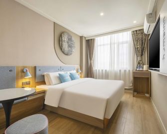 홈 인 칭다오 타이둥 트레이드 에리어 리진 로드 - 칭다오 - 침실