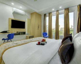 Reebah Inn & Suites - Gurugram - Bedroom