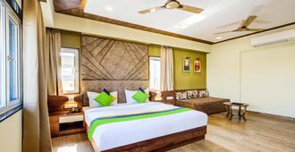 Treebo Trend Opulence Inn - Udaipur - Bedroom