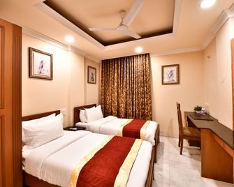 Click White House Residency, Vadodara - Vadodara - Bedroom