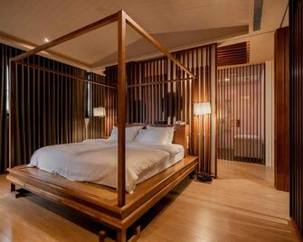 Tian Xia Ju Motel - Yilan City - Bedroom