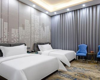 Floral Hotel · Sea Moon Villa hotel (Weihai Sea Park Branch) - Weihai - Bedroom