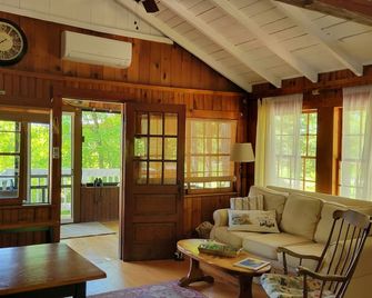 Adorable cottage set among tall pines with sandy beach -only .5 mile from town. - Bridgton - Living room