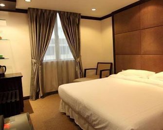 Country Hotel - Klang - Schlafzimmer