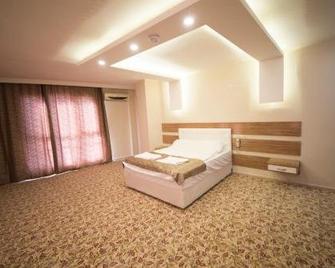 Osmaniye Hanedan Otel - Osmaniye - Bedroom