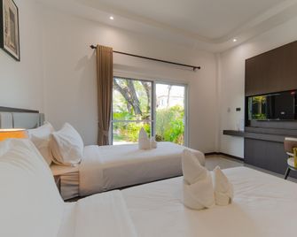 Whale Garden Hotel 101 - Roi Et - Camera da letto