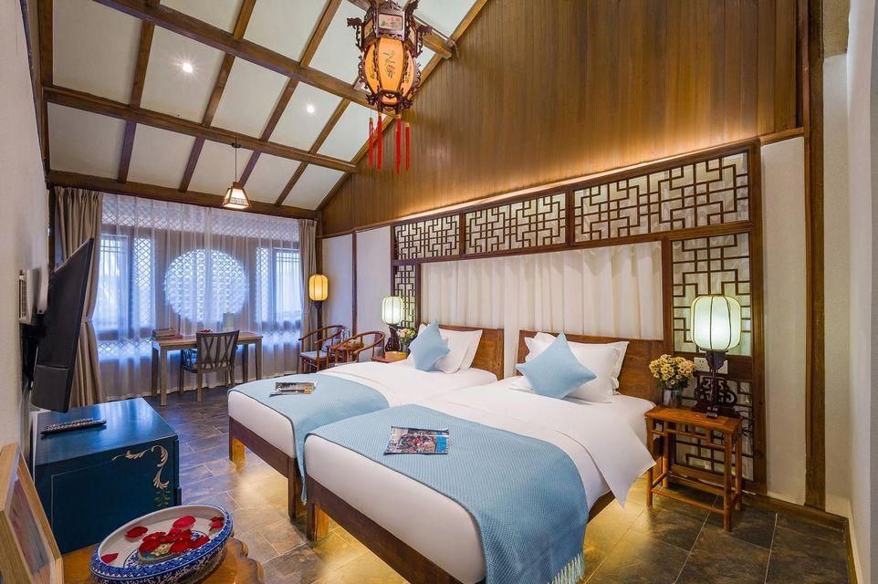 Lijiang Yuncheng Yijing Boutique Inn - ליז'יאנג - חדר שינה