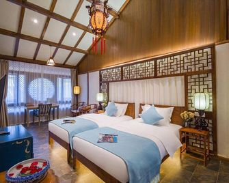 Lijiang Yuncheng Yijing Boutique Inn - ליז'יאנג - חדר שינה