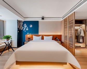 Baotou Di Jing Business Hotel - Baotou - Slaapkamer
