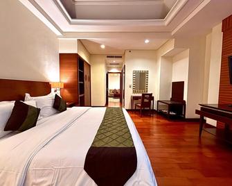 Manado Quality Hotel - Manado - Bedroom