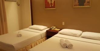 Dumaguete Royal Suite Inn - Dumaguete City - Schlafzimmer