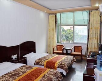 Good Mood Business Inn - Deyang - Спальня